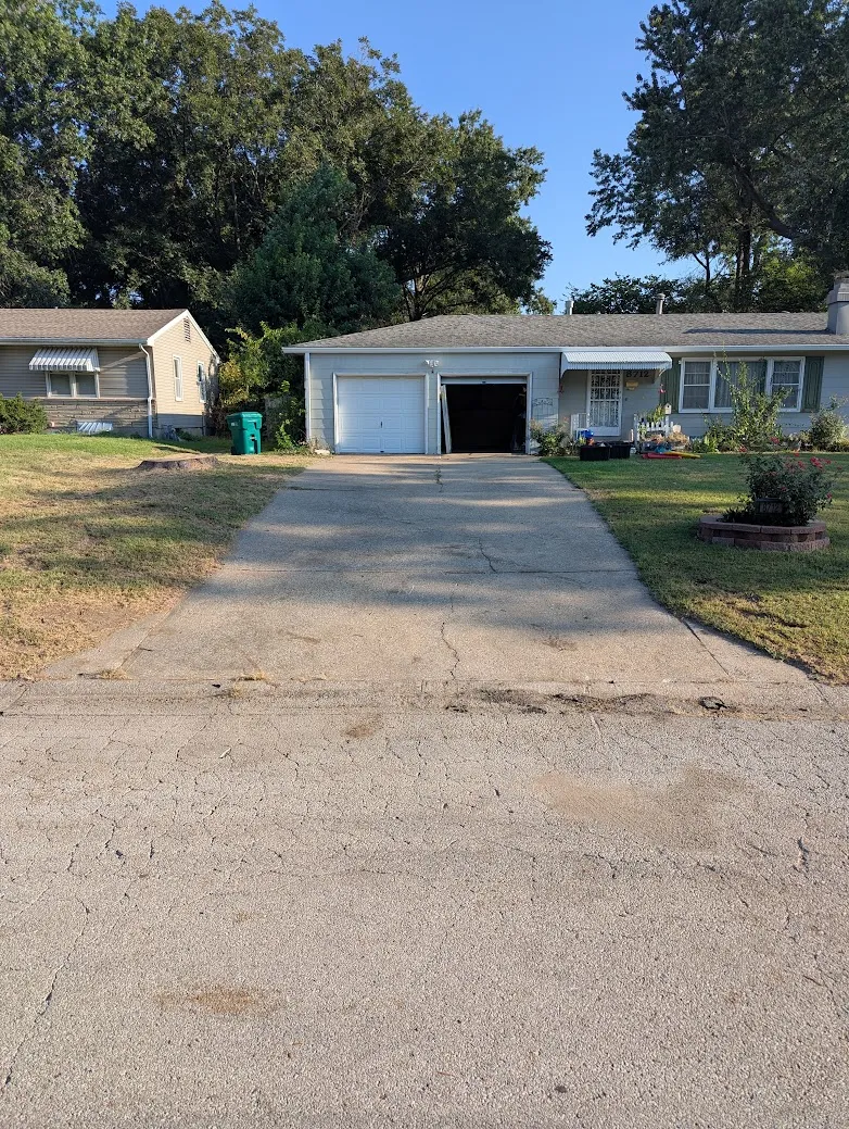 The Hummingbird Driveway before concrete leveling