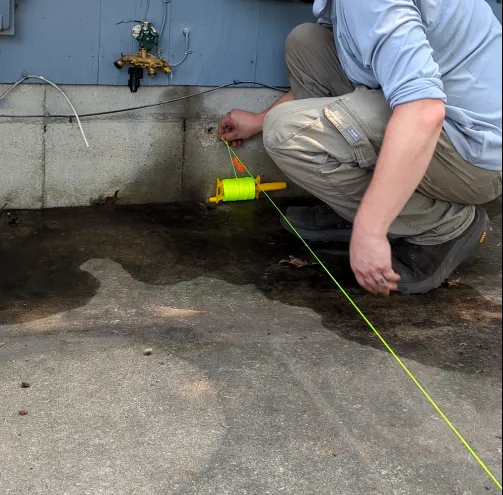 KC Lift & Level evaluating concrete and preparing an injection point